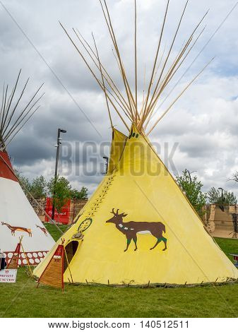 CALGARY, CANADA - JULY 9: View of Tipis in the Indian Village at the Calgary Stampede on July 9, 2016 in Calgary, Alberta. The Indian Village represents First Nations people at the Calgary Stampede.