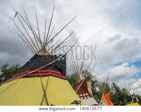 CALGARY, CANADA - JULY 9: View of Tipis in the Indian Village at the Calgary Stampede on July 9, 2016 in Calgary, Alberta. The Indian Village represents First Nations people at the Calgary Stampede.