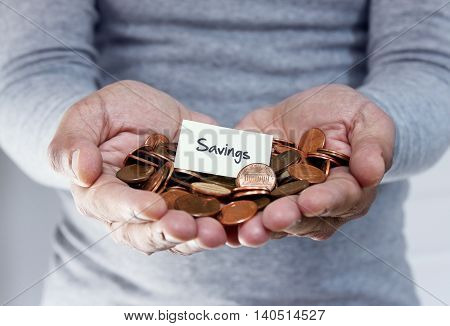 Man holding coins in hand for savings plan