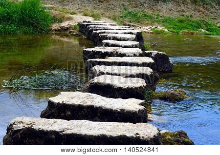 closeup of stepstones crossing a small river