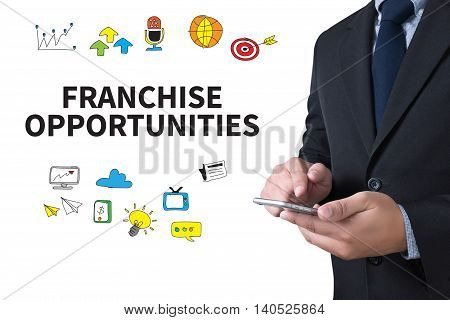 FRANCHISE OPPORTUNITIES businessman working use smartphone computer top