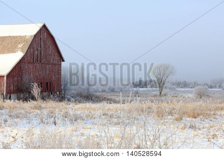 Old weathered barn on a cold January day in Wisconsin.