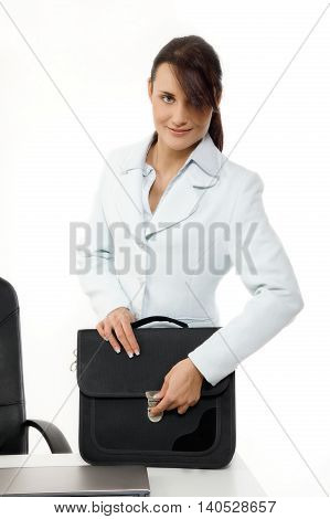 Attractive young businesswoman with briefcase. Business concept