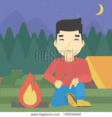 An asian man kindling a campfire on the background of camping site with tent. Tourist relaxing near campfire. Vector flat design illustration. Square layout.