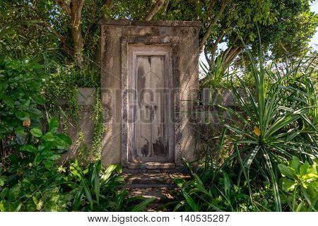 Wooden door entrance to a secret garden