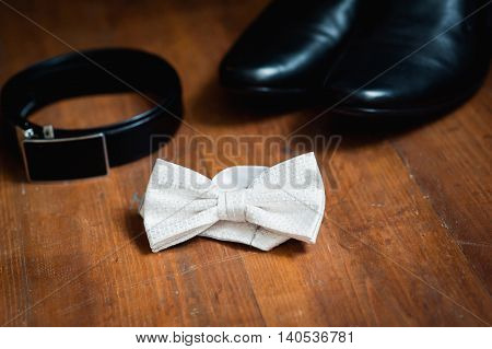 Set of groom clothes. Wedding rings shoes cufflinks and bow tie detalis fashion