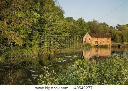 Early Morning Landscape Across River To Old Water Mill