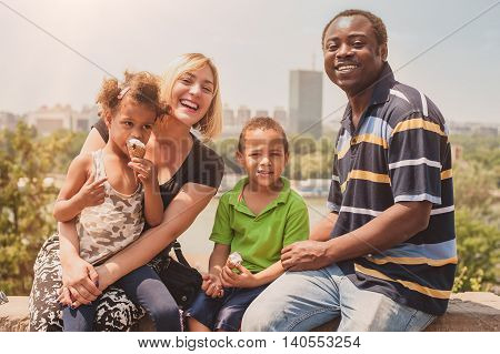 Happy International Family Enjoying While Children Eat Ice Cream Cornet