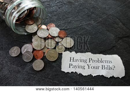 Bill paying trouble message with coins and coinjar