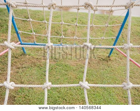 Players on the ropes, Children in playground. Background.