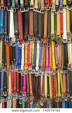 Close up view at collection of colorful belts