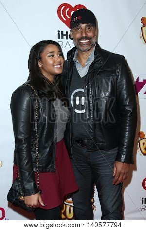 NEW YORK-DEC 12: Former professional basketball player Rick Fox (R) and daughter Sasha Fox attend Z100's Jingle Ball 2014 at Madison Square Garden on December 12, 2014 in New York City.