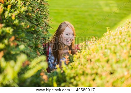 Girl Looks Out Of Bushes Near The Castle