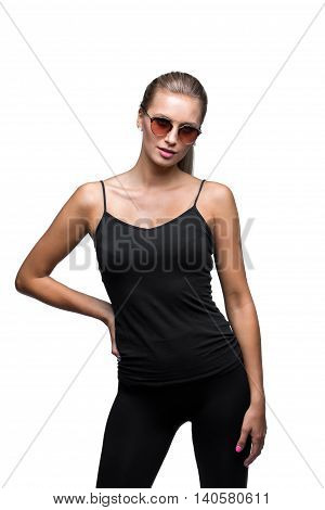 Portrait of the young sexual sporty blonde wearing sunglasses. Isolated on White. Black shirt , tight leggins.