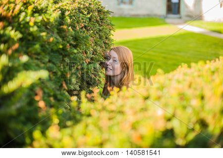 Girl Looks Out Of Bushes Near The Castle
