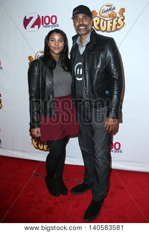 NEW YORK-DEC 12: Former professional basketball player Rick Fox (R) and daughter Sasha Fox attend Z100's Jingle Ball 2014 at Madison Square Garden on December 12, 2014 in New York City.
