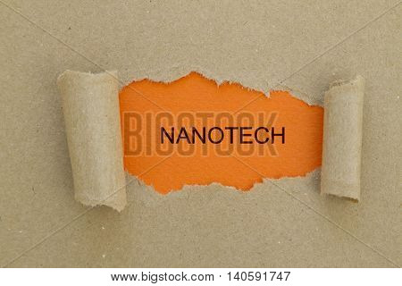 Nanotech word written under torn paper .