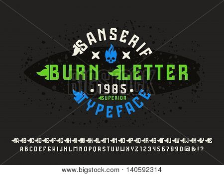 Sanserif font with flame initial letter. Typeface design for t-shirt. Color print on black background