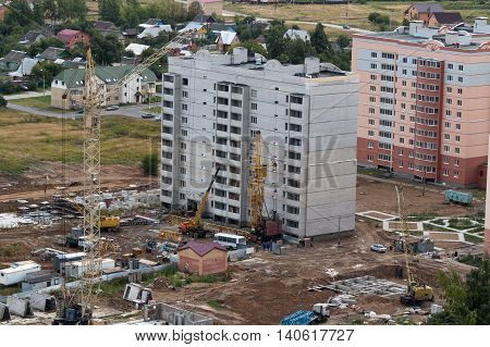 Construction site high-rise residential buildings with tower cranes