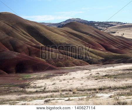 The rich reds and browns of the Painted Hills of Oregon stand out.