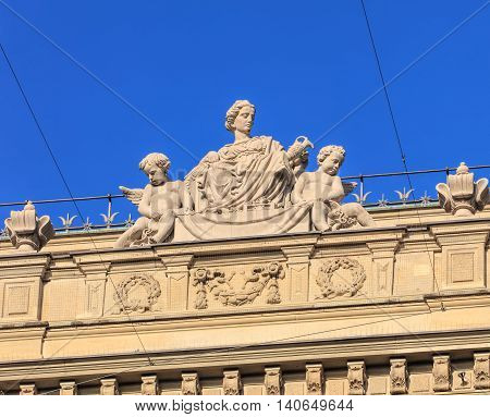 Zurich, Switzerland - 30 July, 2016: upper part of the Credit Suisse building on Paradeplatz square, view from Bahnhofstrasse street. Credit Suisse Group is a Swiss multinational financial services holding company headquartered in Zurich.