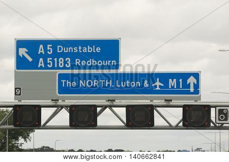 Motorway sign to the North of England. Mentioning Luton Luton Airport Dunstable and Redbourn