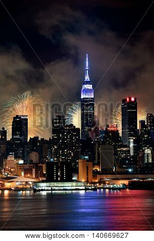 NEW YORK CITY - JUL 4: Empire State Building with fireworks on July 4, 2015 in Manhattan, New York City. With population of 8.4M, it is the most populous city in the United States.
