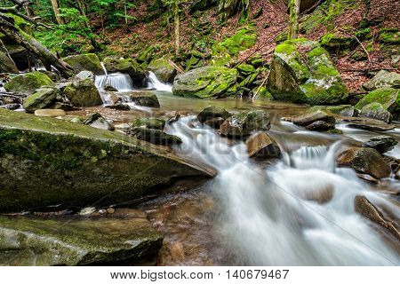 Small Cascades On The River Among Bouders