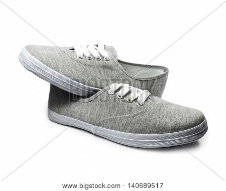 Grey sneakers or sneaker shoes, isolated on white background.