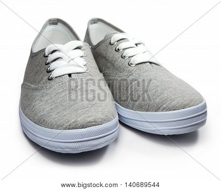 Grey sneakers or sneaker shoes, isolated on white background.