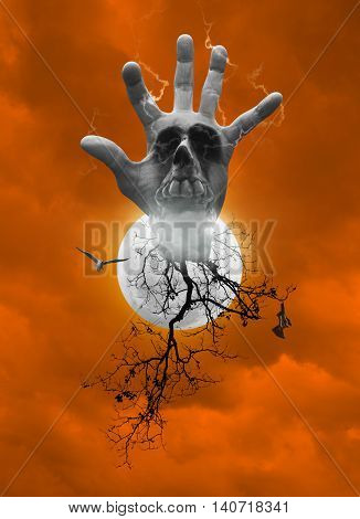 Hand blend with human skull smoke dead tree bird fly bat scream over moon and dark strom sky orange tone Halloween concept