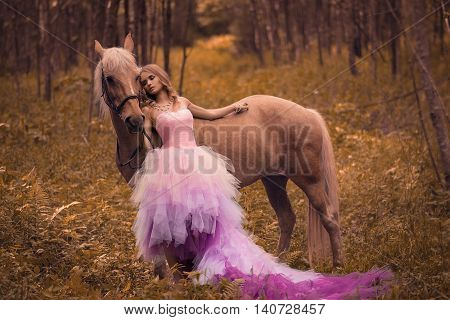 Young lady with her dreaming look in the forest