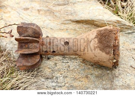 old abandoned bomb shell case from second world war found in the mountains