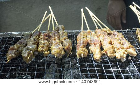 Asian food - Satay is grilled over coals.