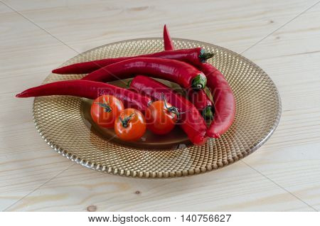 red cherry tomatoes peppers on a plate