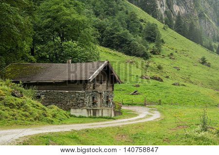 house made of stone in mountains of Alps Austria