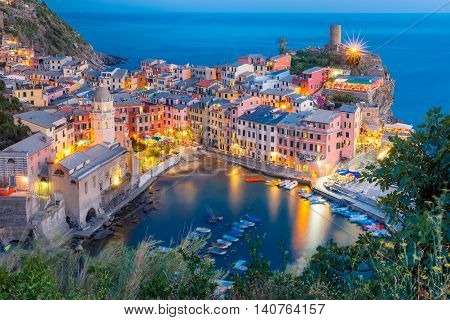Aerial night view of Vernazza village, seascape in Five lands, Cinque Terre National Park, Liguria, Italy.