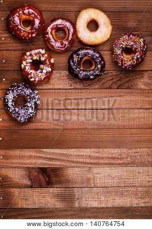 bright donuts on wooden background.donut, chanukah, hanukkah, dessert,