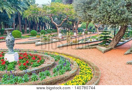 The lush trees and beautiful flower beds in Bahai Gardens Haifa Israel.