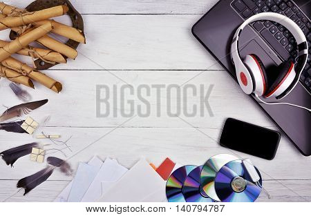 The evolution of communication. From the banal to the present. Horse-mail bird-mail envelopes CDs a smartphone a computer. Top view. Attributes poshlogoi modern life. Advances in technology help to communicate more and faster.