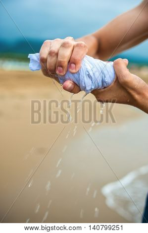 Hands Wring Out A Wet Cloth