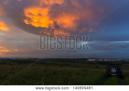 Leningrad region, Russia , July 30, 2016 , Jeep Wrangler at sunset on grief Pulkovo, the Jeep Wrangler is a compact four wheel drive off road and sport utility vehicle