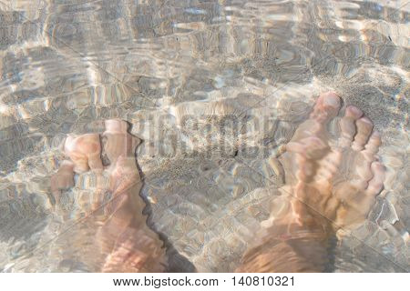 Feet in the clear sea water. Black sea