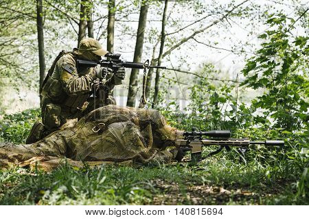 Sniper and spotter of Green Berets US Army Special Forces Group in action