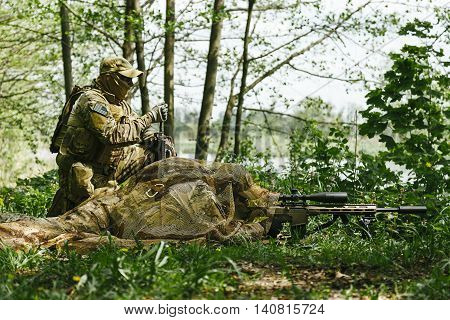 Sniper and spotter of Green Berets US Army Special Forces Group in action