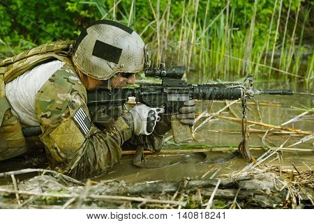 Green Berets US Army Special Forces Group soldier in action