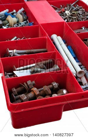 Plastic box for small ironware. Nails screws dowels. Isolated on white background with clipping path