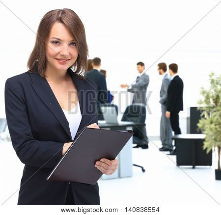 Portrait of young happy smiling businesswoman with  folder,