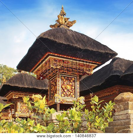traditional Balinese architecture - temple with black straw roof