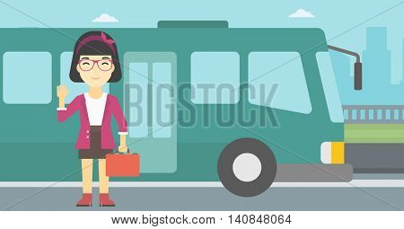 An asian young woman with suitcase standing at the entrance door of a bus on a city background. Young woman waving in front of a bus. Vector flat design illustration. Horizontal  layout.